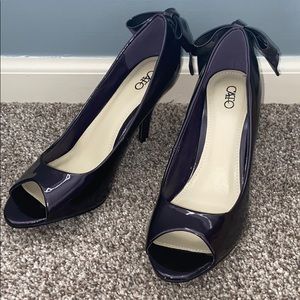 Purple heels with a bow at the back
